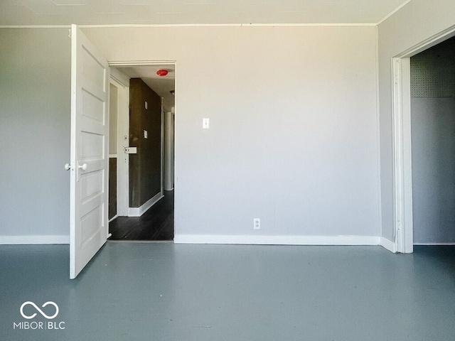 312 S Gharkey St, Muncie, IN 47305 - empty room featuring baseboards and finished concrete floors