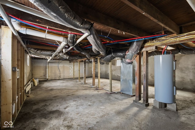 unfinished basement featuring heating unit and water heater