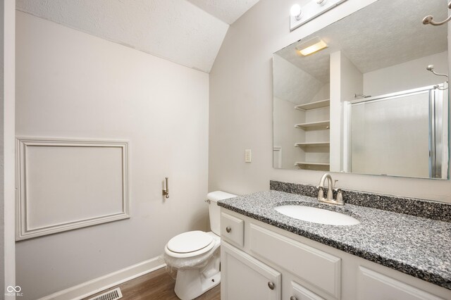 4786 N Mill Ct, Greenfield, IN 46140 - full bath with lofted ceiling, baseboards, wood finished floors, a stall shower, and a textured ceiling
