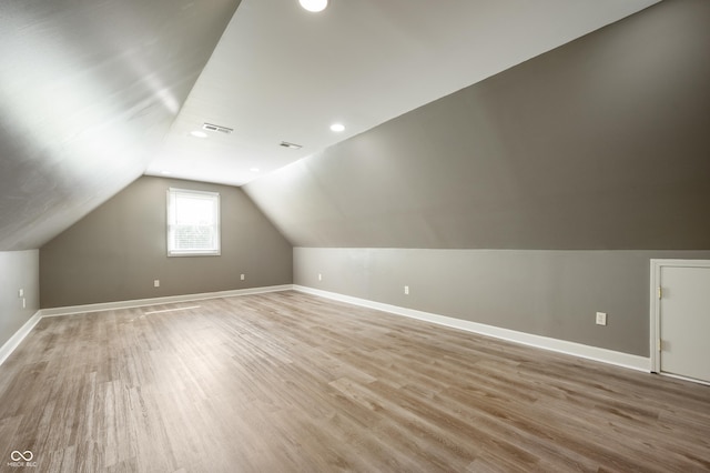 4786 N Mill Ct, Greenfield, IN 46140 - bonus room featuring vaulted ceiling, baseboards, light wood-style flooring, and recessed lighting