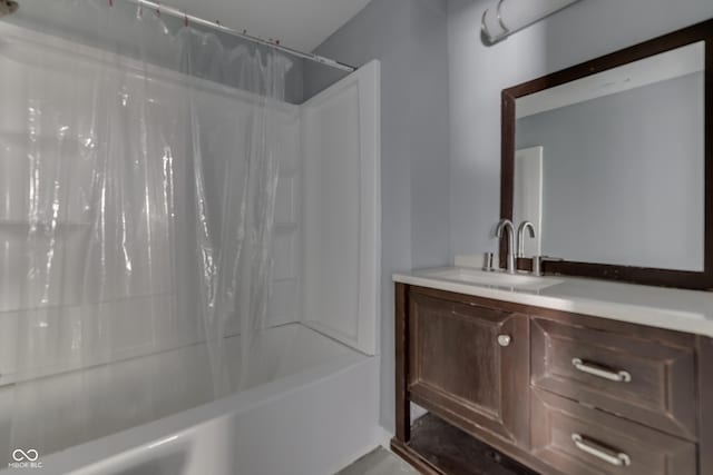 full bath featuring vanity and shower / bath combo with shower curtain