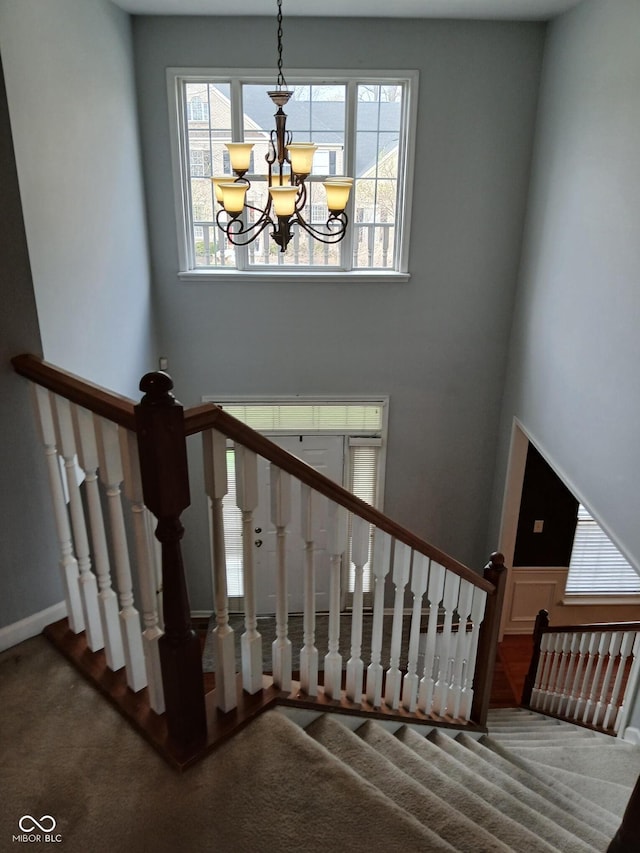 5983 Clearview Dr, Carmel, IN 46033 - stairs with a notable chandelier, baseboards, and carpet floors