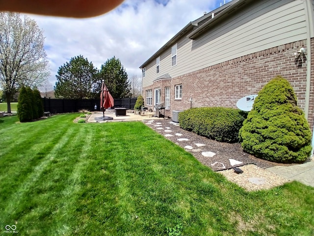 5983 Clearview Dr, Carmel, IN 46033 - view of yard with a patio, a fire pit, central AC, and fence