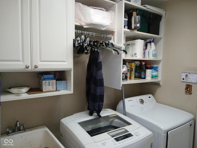 5983 Clearview Dr, Carmel, IN 46033 - laundry room featuring a sink, cabinet space, and washing machine and dryer