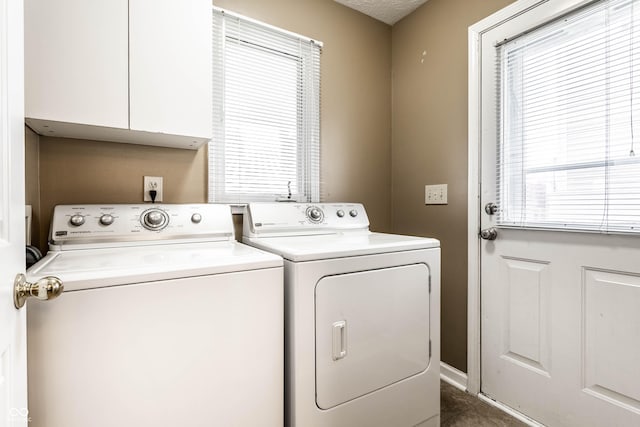 washroom with tile patterned flooring, washer and dryer, and laundry area