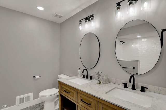 full bathroom with visible vents, a sink, and toilet