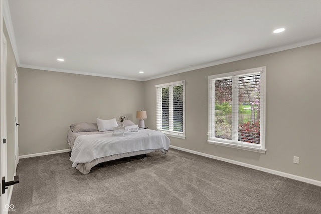 bedroom featuring multiple windows, baseboards, and ornamental molding