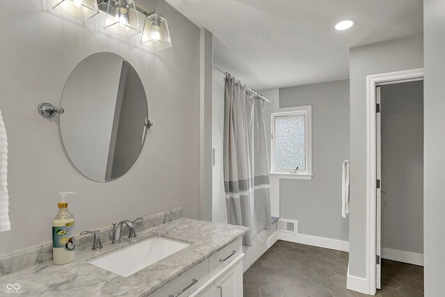 full bath featuring vanity, tile patterned floors, visible vents, and recessed lighting
