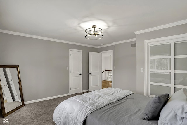 bedroom featuring visible vents, crown molding, baseboards, a chandelier, and carpet flooring