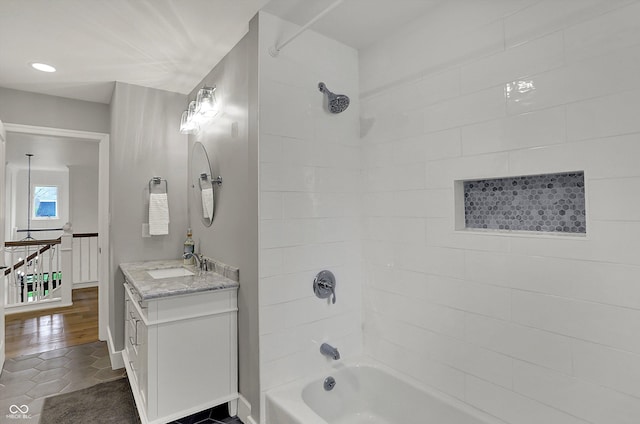 bathroom featuring bathtub / shower combination, tile patterned floors, and vanity
