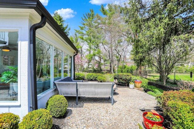 view of patio with a sunroom