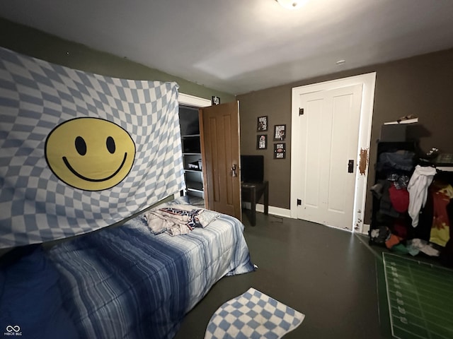 bedroom featuring finished concrete floors