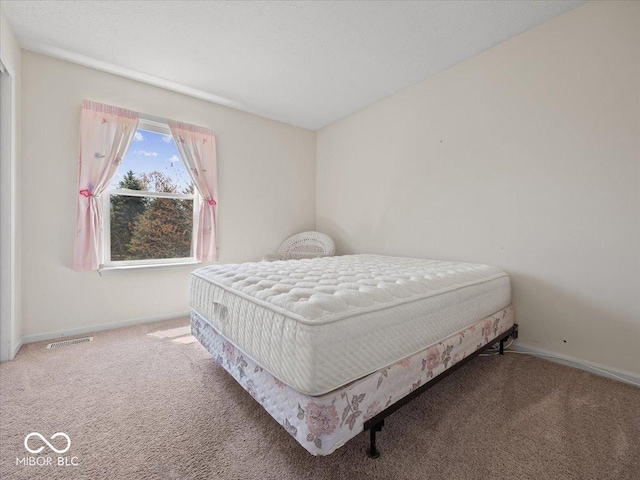 bedroom with carpet, baseboards, and visible vents