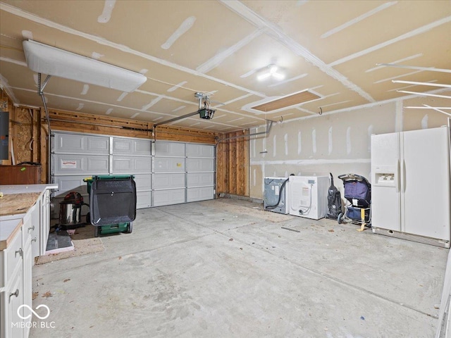 garage with white fridge with ice dispenser and a garage door opener
