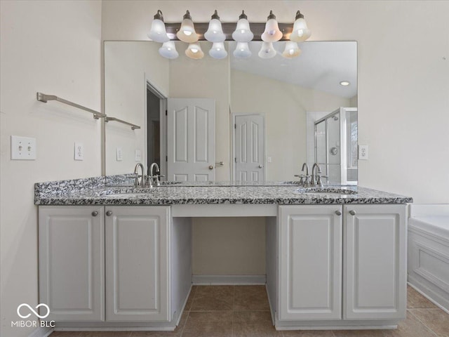 full bath featuring a shower stall, tile patterned flooring, double vanity, and a sink