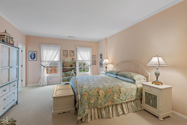 carpeted bedroom with baseboards, ornamental molding, and visible vents