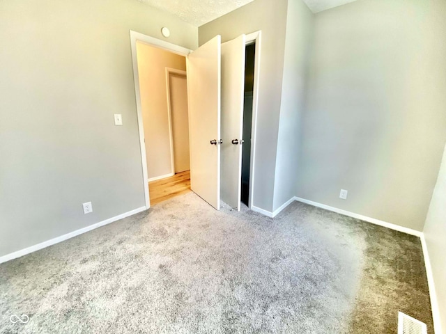 110 Renee Dr, Ellettsville, IN 47429 - unfurnished bedroom featuring carpet flooring and baseboards