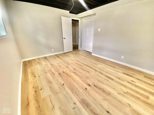 110 Renee Dr, Ellettsville, IN 47429 - empty room with wood finished floors and baseboards