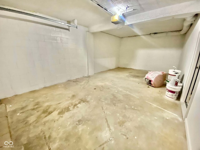 110 Renee Dr, Ellettsville, IN 47429 - garage with a garage door opener and concrete block wall
