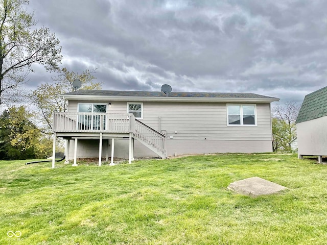 110 Renee Dr, Ellettsville, IN 47429 - back of property featuring a deck, stairs, and a yard
