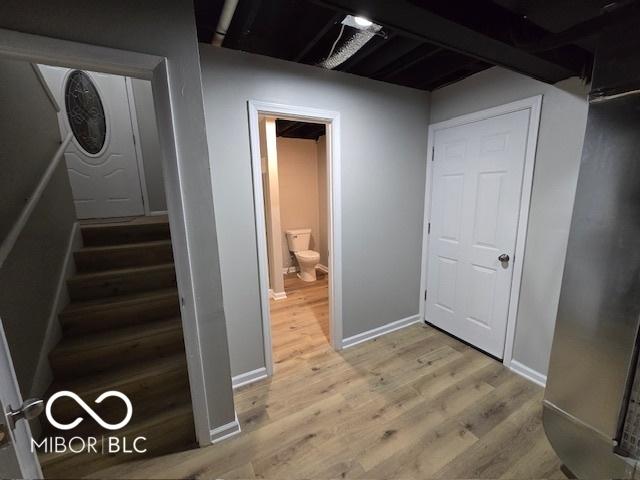 110 Renee Dr, Ellettsville, IN 47429 - stairs featuring wood finished floors