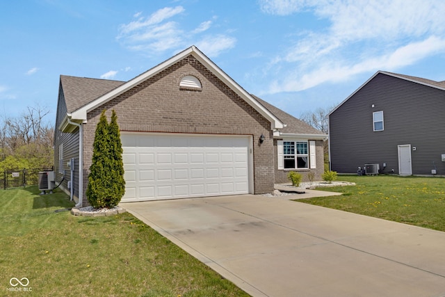 4323 Stubbington Ln, Indianapolis, IN 46239 - view of front of property with brick siding, a front lawn, driveway, and an attached garage