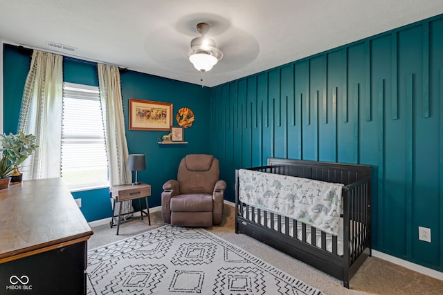 4323 Stubbington Ln, Indianapolis, IN 46239 - bedroom featuring baseboards, a nursery area, carpet flooring, and ceiling fan
