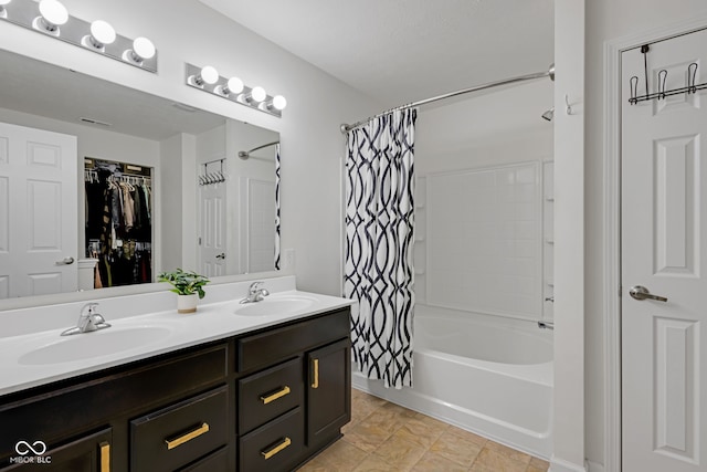 4323 Stubbington Ln, Indianapolis, IN 46239 - bathroom with shower / bath combo with shower curtain, double vanity, and a spacious closet