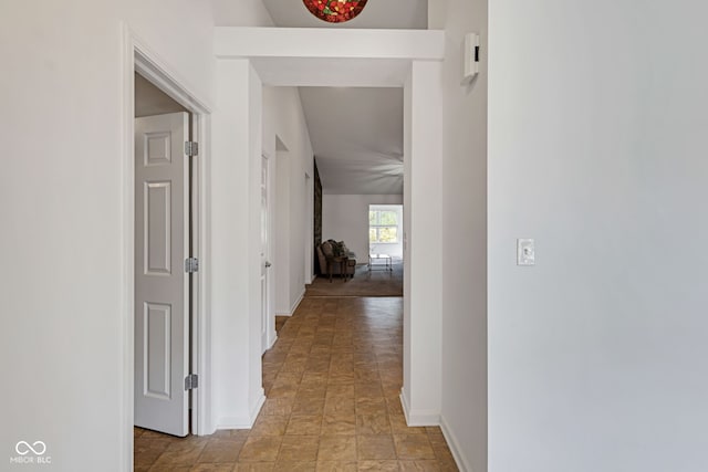 4323 Stubbington Ln, Indianapolis, IN 46239 - hall with baseboards and light stone finish flooring