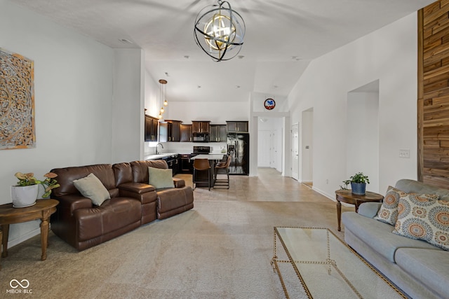 4323 Stubbington Ln, Indianapolis, IN 46239 - living area with a chandelier, light carpet, vaulted ceiling, and baseboards