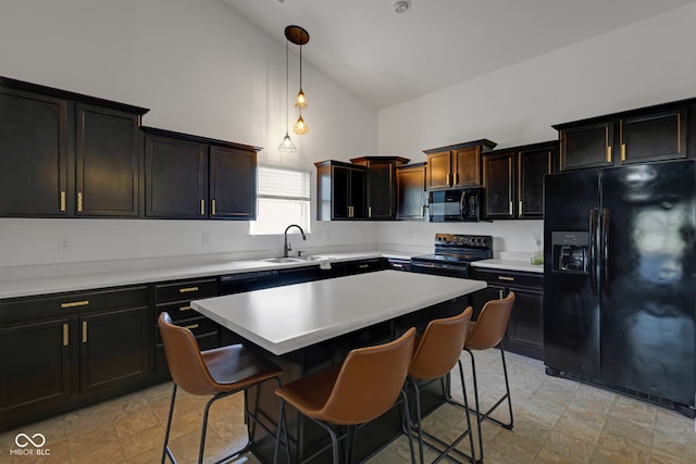 4323 Stubbington Ln, Indianapolis, IN 46239 - kitchen featuring black appliances, high vaulted ceiling, a kitchen breakfast bar, light countertops, and decorative light fixtures