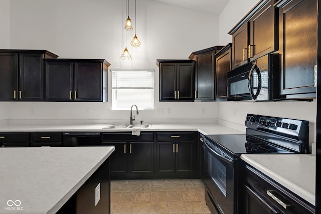 4323 Stubbington Ln, Indianapolis, IN 46239 - kitchen featuring black appliances, a sink, light countertops, and hanging light fixtures