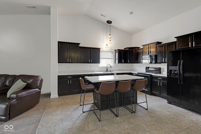 4323 Stubbington Ln, Indianapolis, IN 46239 - kitchen with black appliances, a sink, open floor plan, light countertops, and high vaulted ceiling