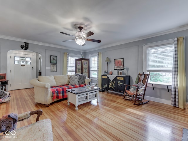 57 Worman St, Indianapolis, IN 46227 - living area featuring ceiling fan, arched walkways, ornamental molding, and light wood-style flooring