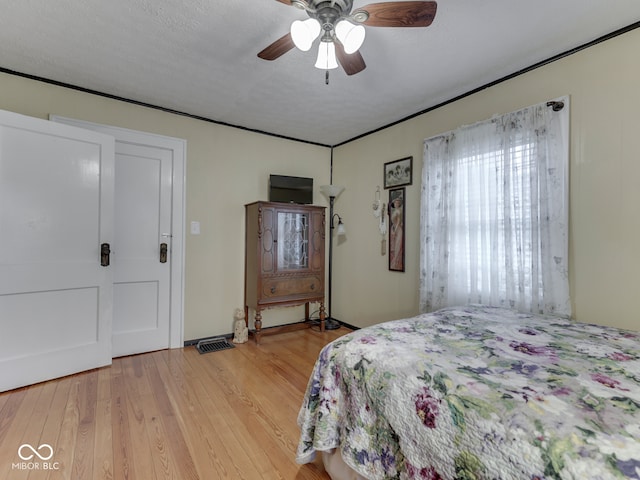 57 Worman St, Indianapolis, IN 46227 - bedroom with light wood-style floors and ceiling fan