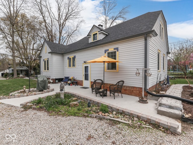 57 Worman St, Indianapolis, IN 46227 - rear view of property with a patio area, a shingled roof, and a trampoline