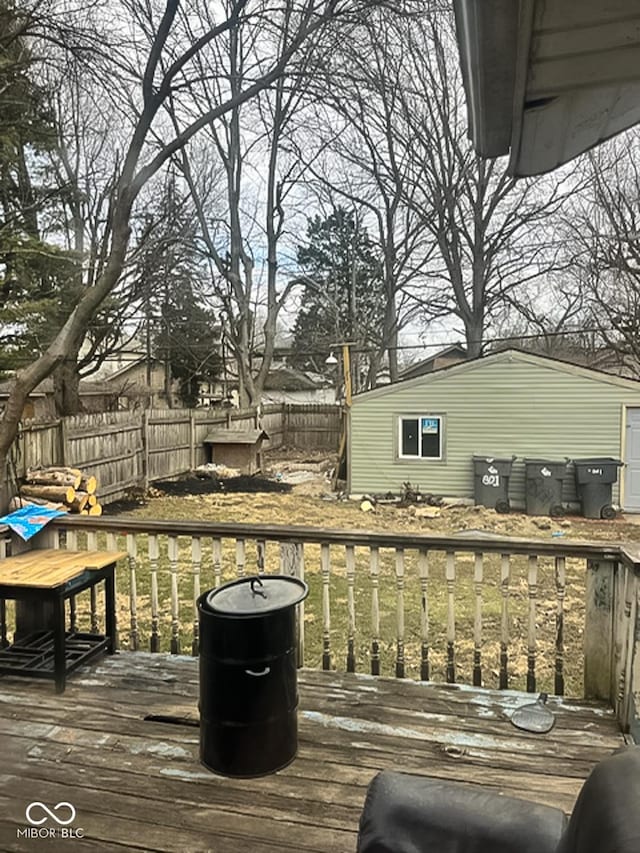 801 N Denny St, Indianapolis, IN 46201 - wooden terrace with a fenced backyard, an outdoor structure, and a storage unit