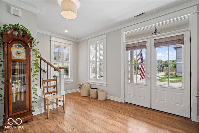 7638 Beekman Ter, Zionsville, IN 46077 - entrance foyer featuring french doors, stairs, baseboards, wood finished floors, and ornamental molding