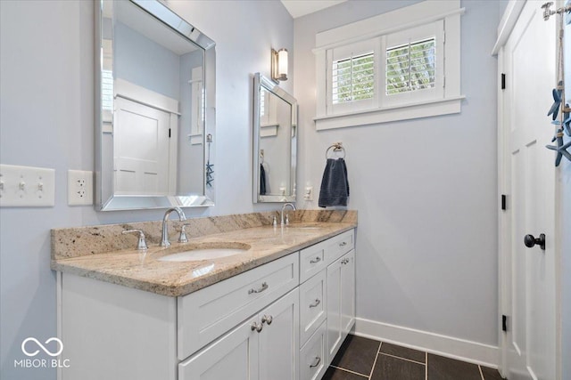 7638 Beekman Ter, Zionsville, IN 46077 - full bath featuring baseboards, double vanity, and tile patterned flooring