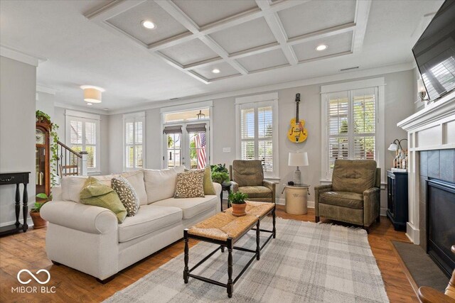 7638 Beekman Ter, Zionsville, IN 46077 - living area with crown molding, plenty of natural light, recessed lighting, a tiled fireplace, and coffered ceiling
