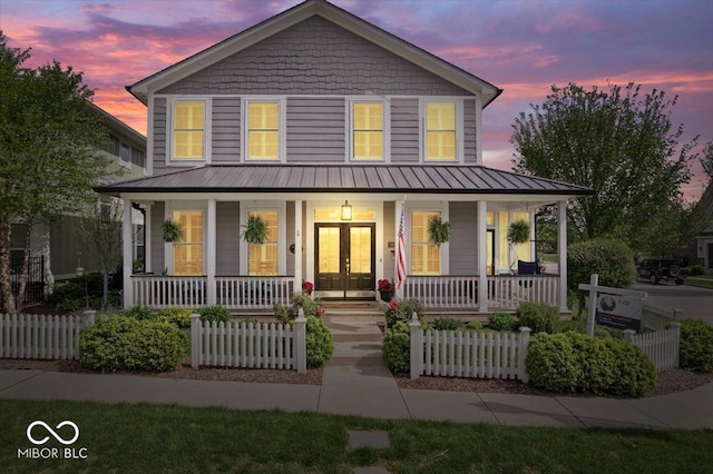 7638 Beekman Ter, Zionsville, IN 46077 - farmhouse with covered porch, a fenced front yard, metal roof, and a standing seam roof