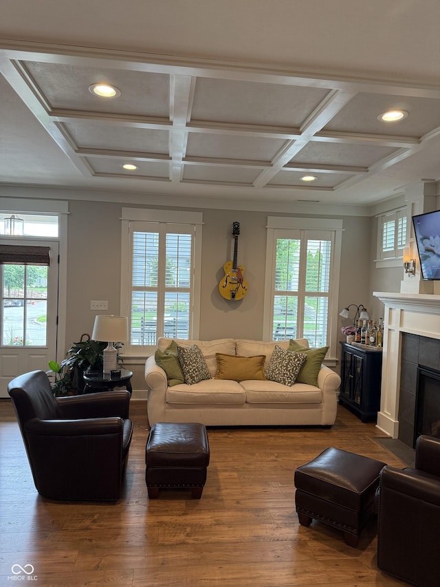 7638 Beekman Ter, Zionsville, IN 46077 - living room featuring coffered ceiling, recessed lighting, wood finished floors, a tile fireplace, and beamed ceiling