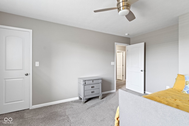 carpeted bedroom with baseboards and ceiling fan
