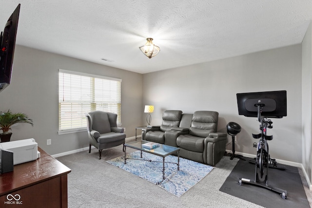 living room featuring carpet floors, a textured ceiling, and baseboards