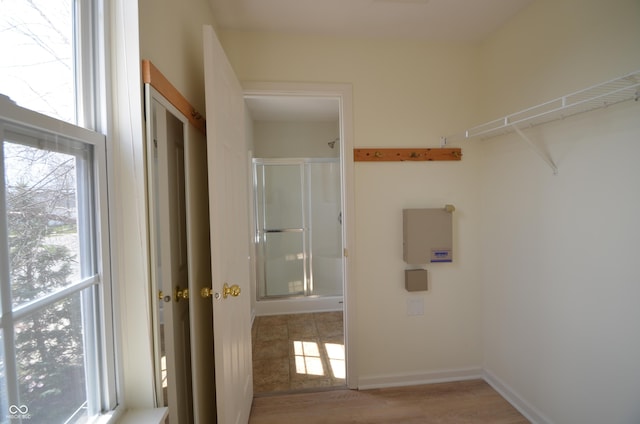 washroom featuring light wood-style flooring and plenty of natural light