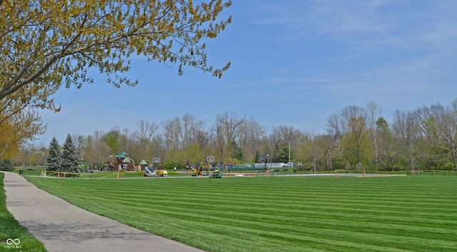 surrounding community featuring a yard and playground community