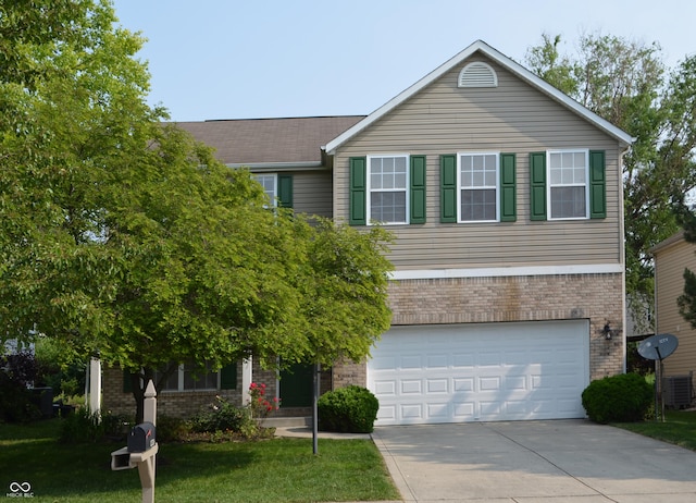 12326 River Valley Dr, Fishers, IN 46037 - view of front of property with brick siding, driveway, a front yard, and a garage