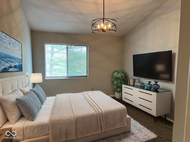 4311 Village Parkway Cir W Unit 6, Indianapolis, IN 46254 - bedroom featuring dark colored carpet and an inviting chandelier