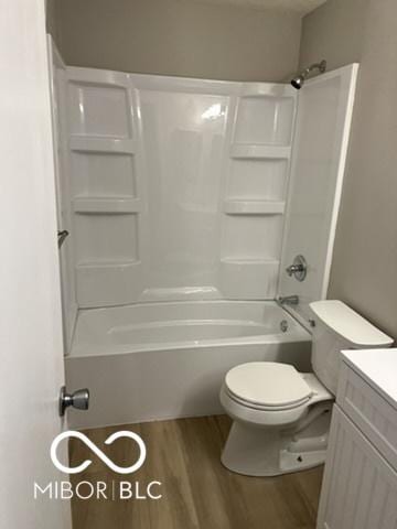 4311 Village Parkway Cir W Unit 6, Indianapolis, IN 46254 - bathroom with shower / bathing tub combination, wood finished floors, toilet, and vanity