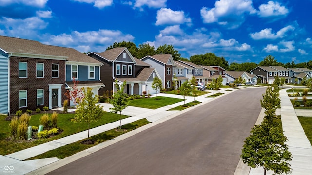 view of street with sidewalks and a residential view